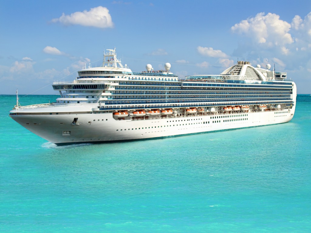 Luxury cruise ship sailing from port